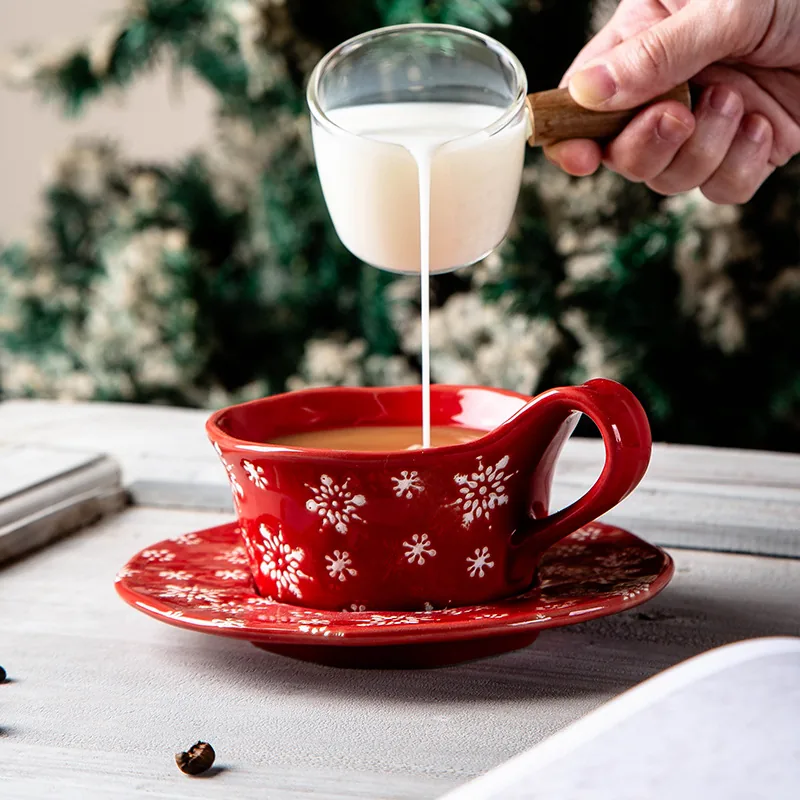 Red snowflake ceramic Christmas coffee cup and saucer