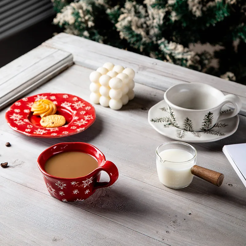 Red and white Christmas ceramic coffee cup sets on a table