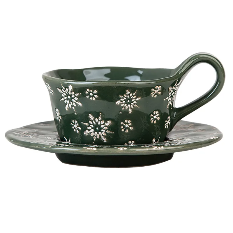 Green snowflake ceramic coffee cup and saucer set