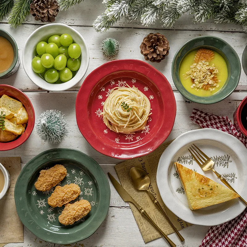 Christmas ceramic plates and bowls with food