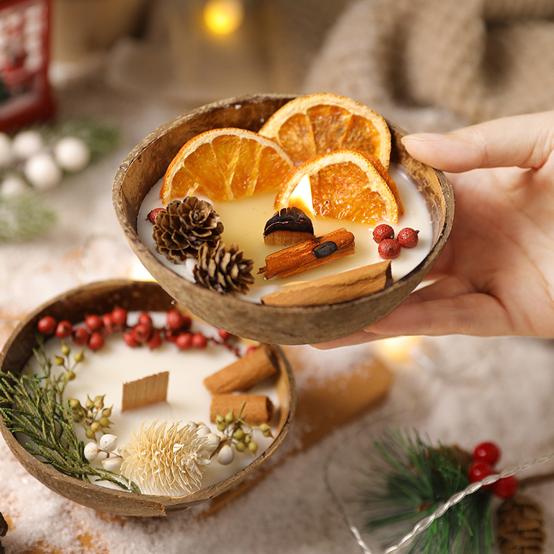 Handheld glowing botanical coconut bowl candle