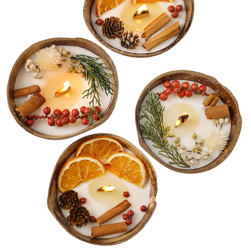 Four Christmas coconut bowl candle designs on white background