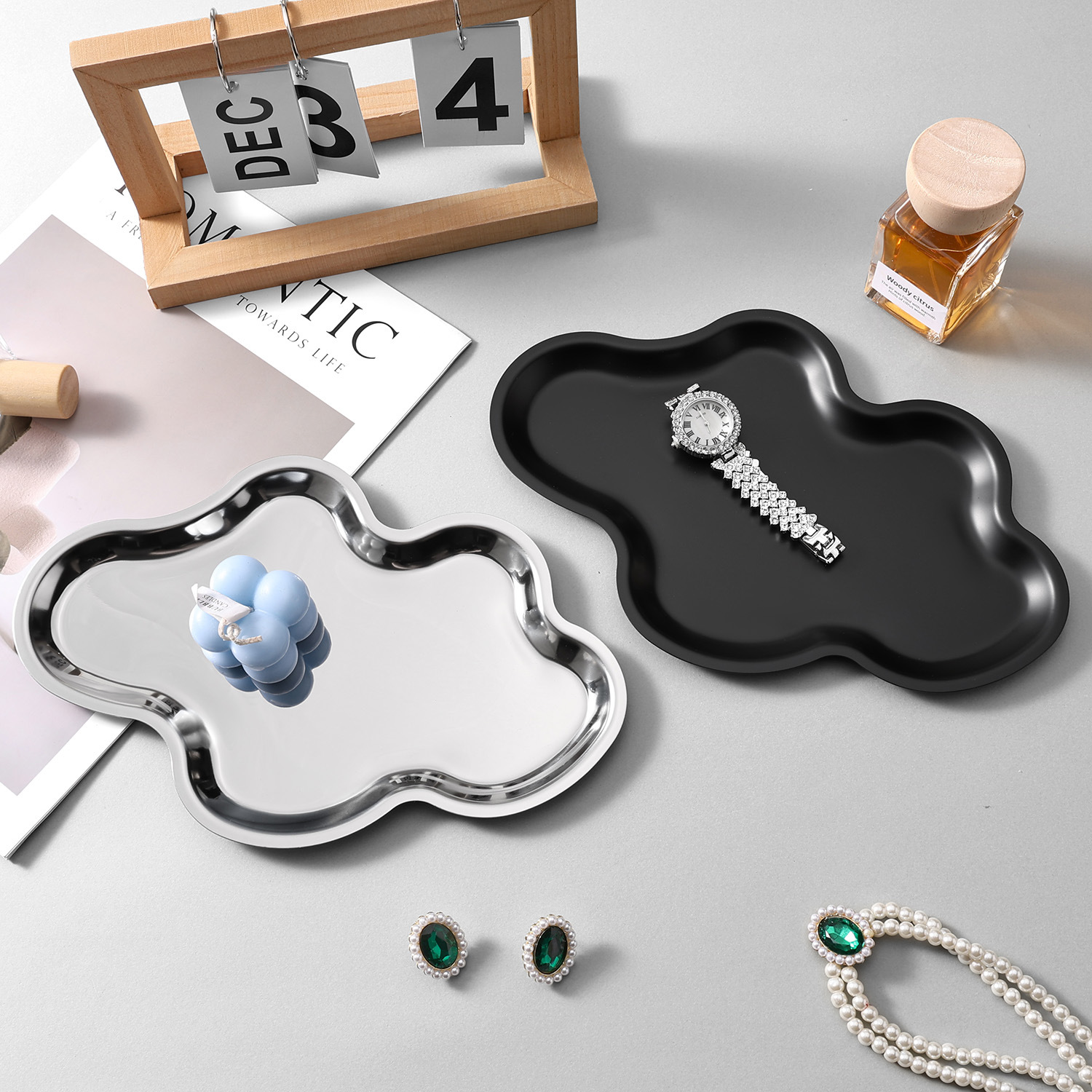 Silver and black decorative storage trays with jewelry