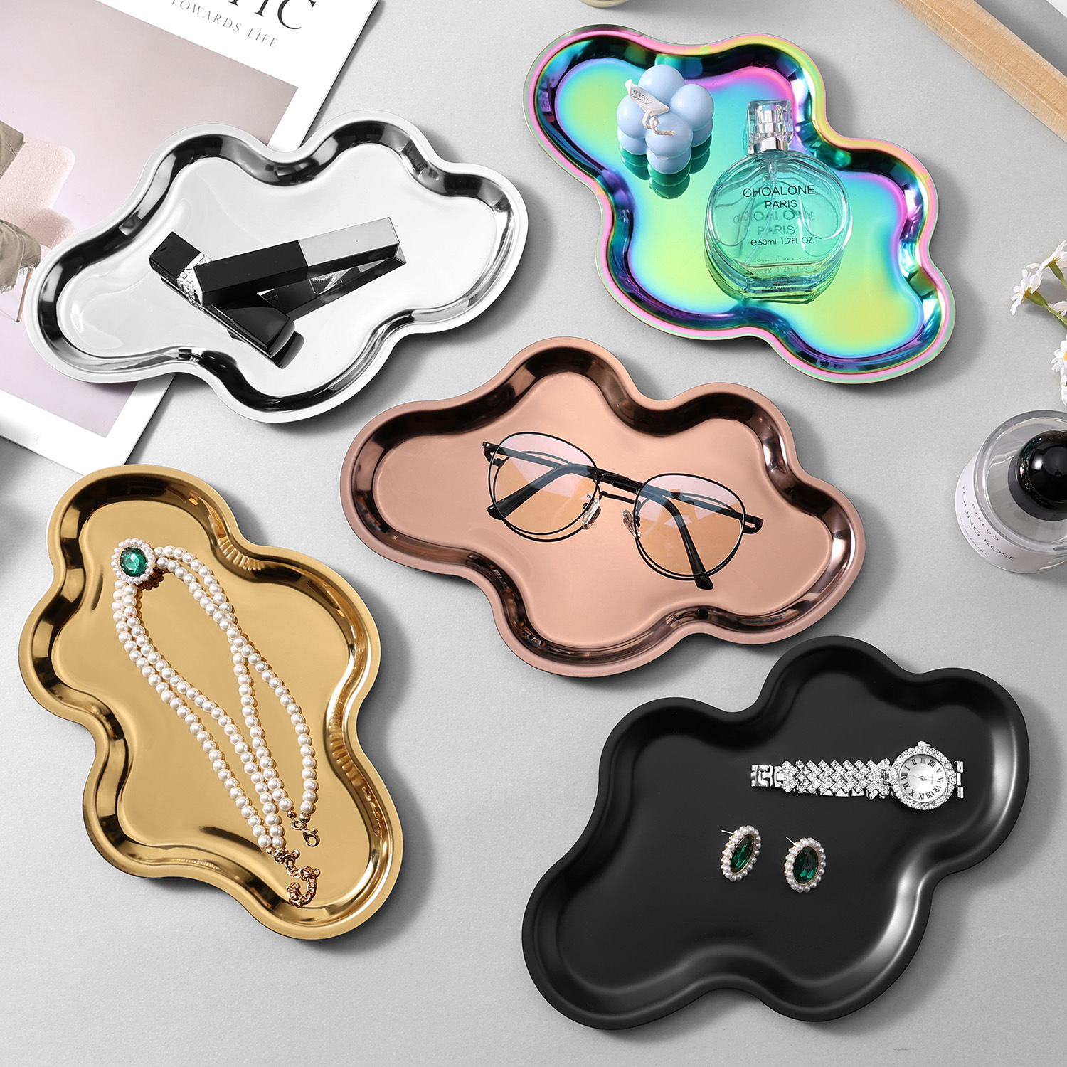 Five cloud-shaped storage tray color options
