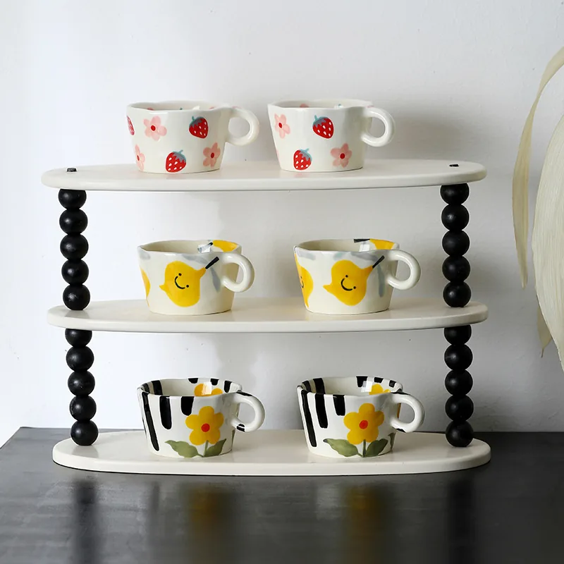 Assorted painted ceramic mug designs