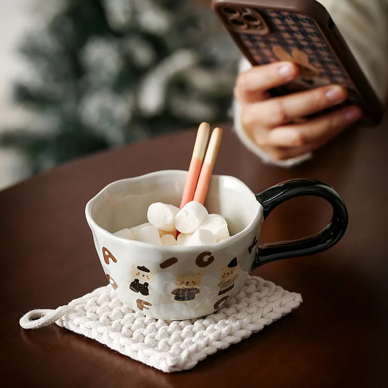Gray illustrated ceramic mug with black handle