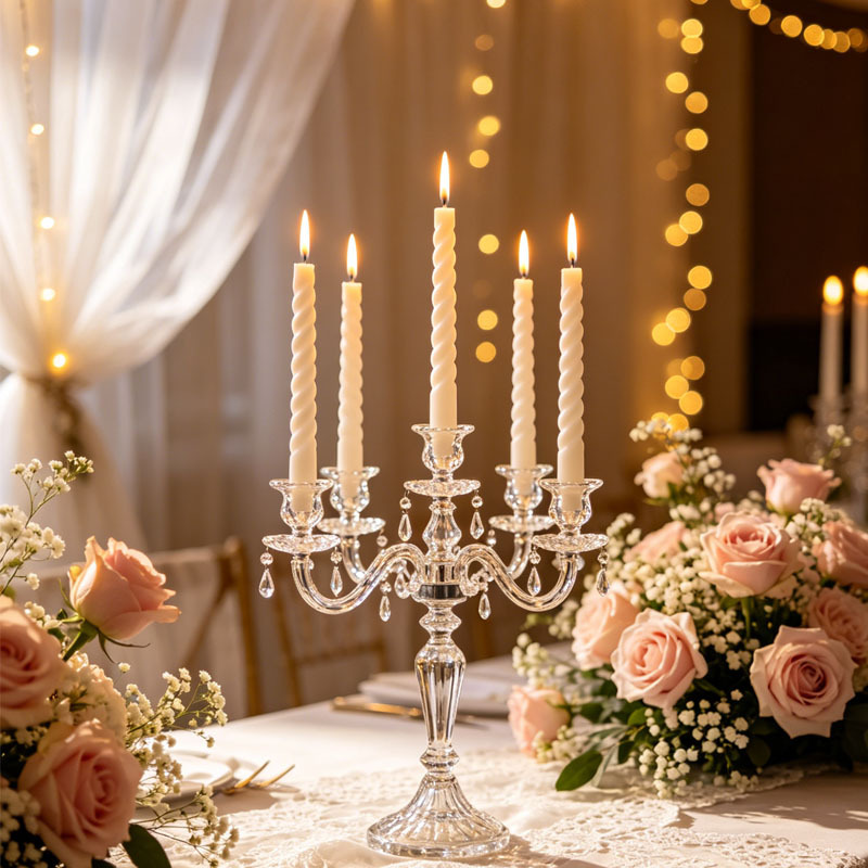 White spiral taper candles displayed at a wedding reception