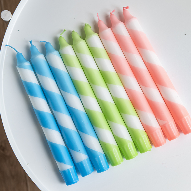 Blue, green and pink striped scented taper candles