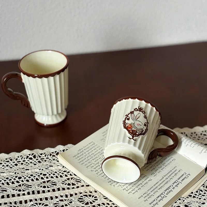 Fluted rabbit coffee mug showing pedestal base and ornate handle
