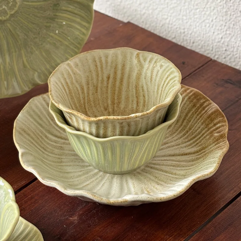 Floral ceramic bowls stacked on a matching plate