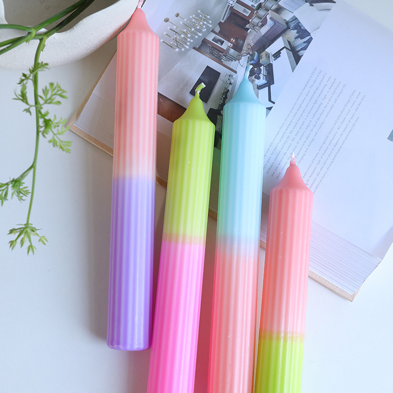 Four pastel gradient ribbed taper candle designs