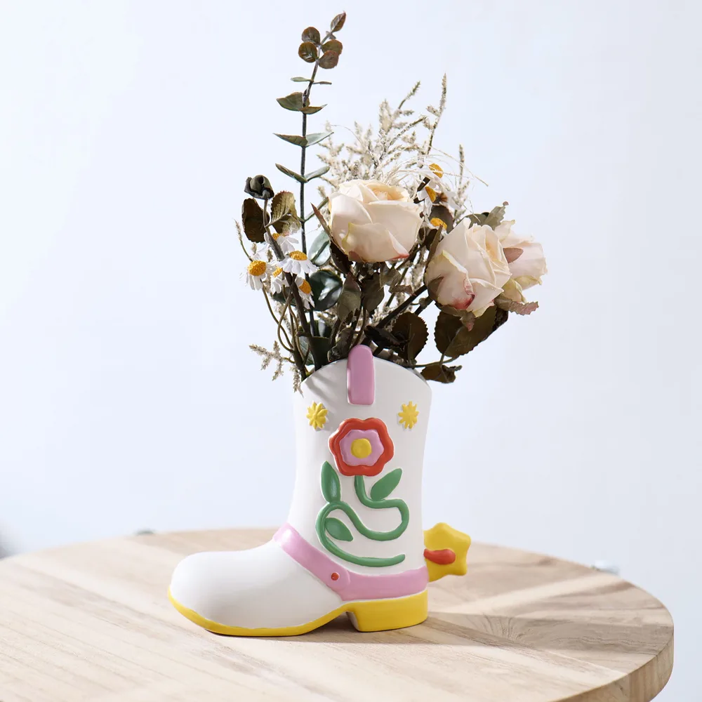 Boot ceramic flower vase with dried floral arrangement