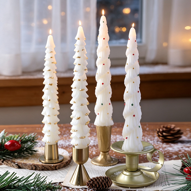White Christmas tree taper candles in a holiday setting