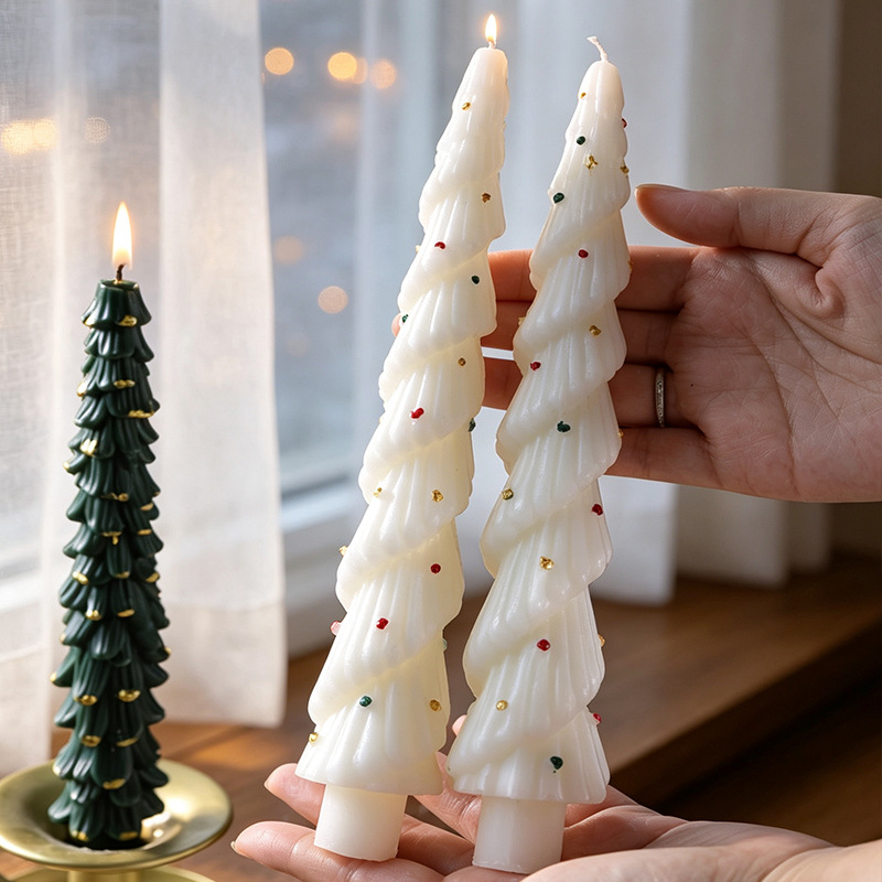 Handheld white Christmas tree candles with painted decorations
