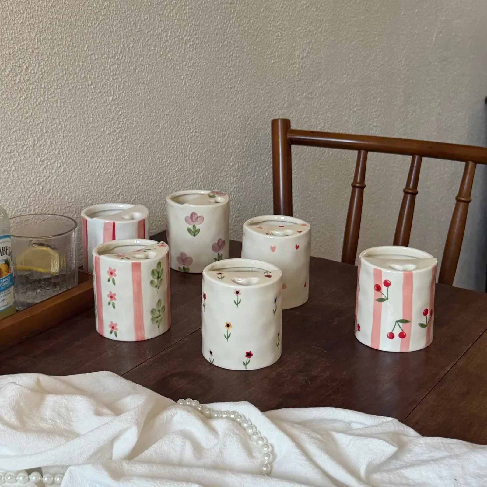 Complete assortment of hand-painted ceramic mugs