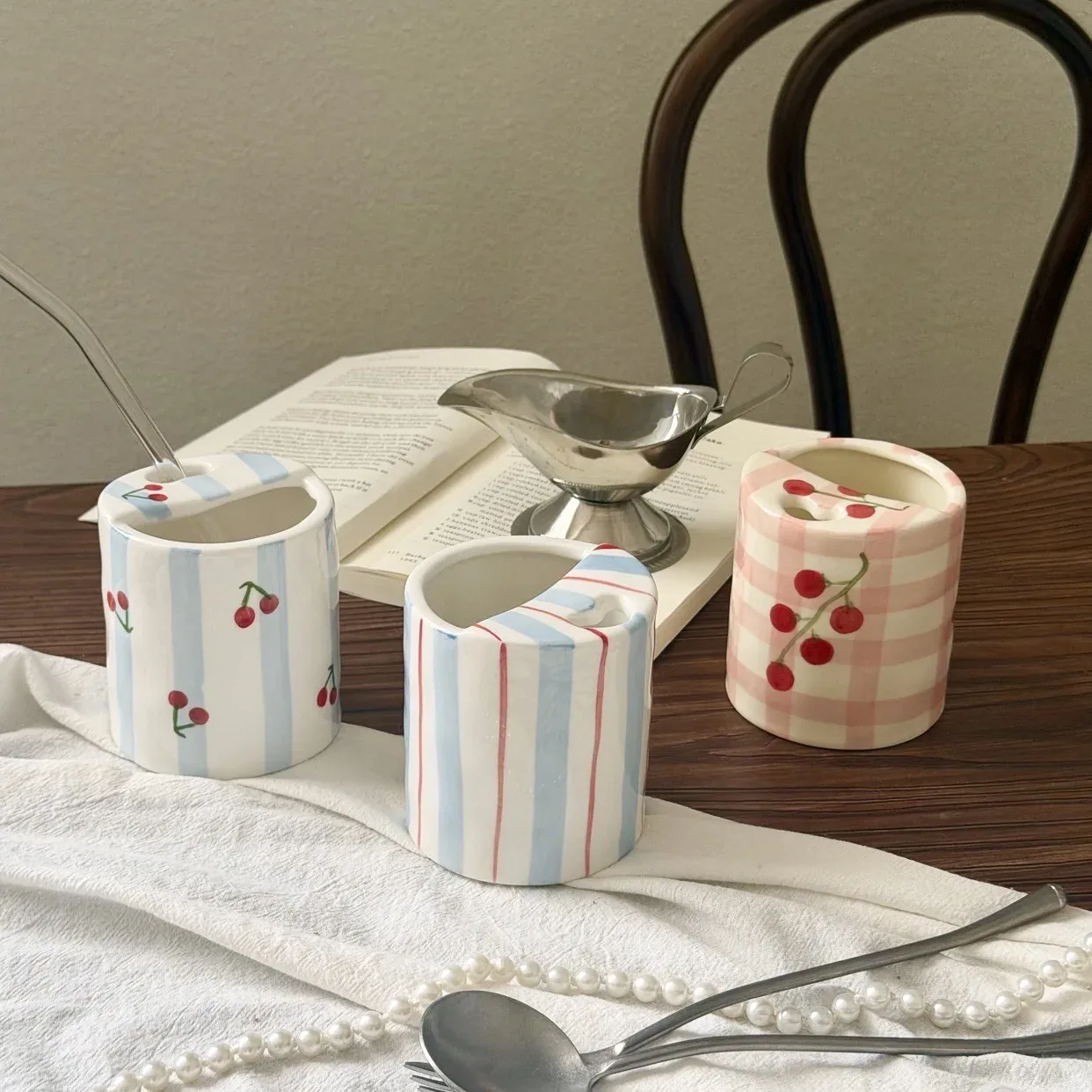 Three hand-painted ceramic mug patterns