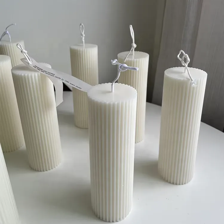 Tall white handmade ribbed pillar candles