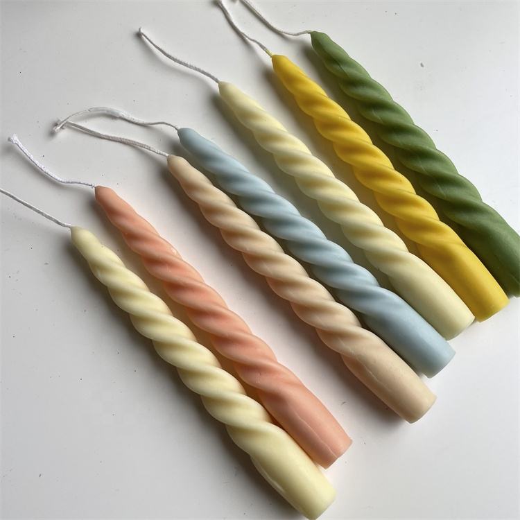 Handmade twist candles in peach, ivory, blue, yellow and green