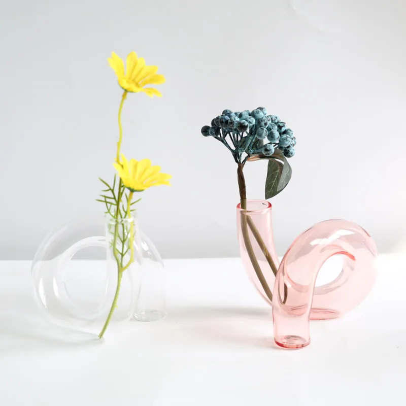 Clear and pink loop-shaped glass vases