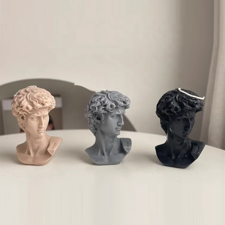 Three handmade David bust candles