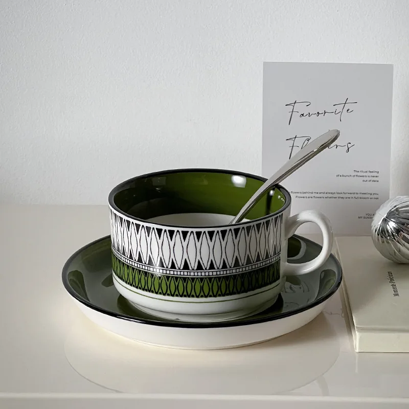 Green geometric ceramic coffee cup and saucer