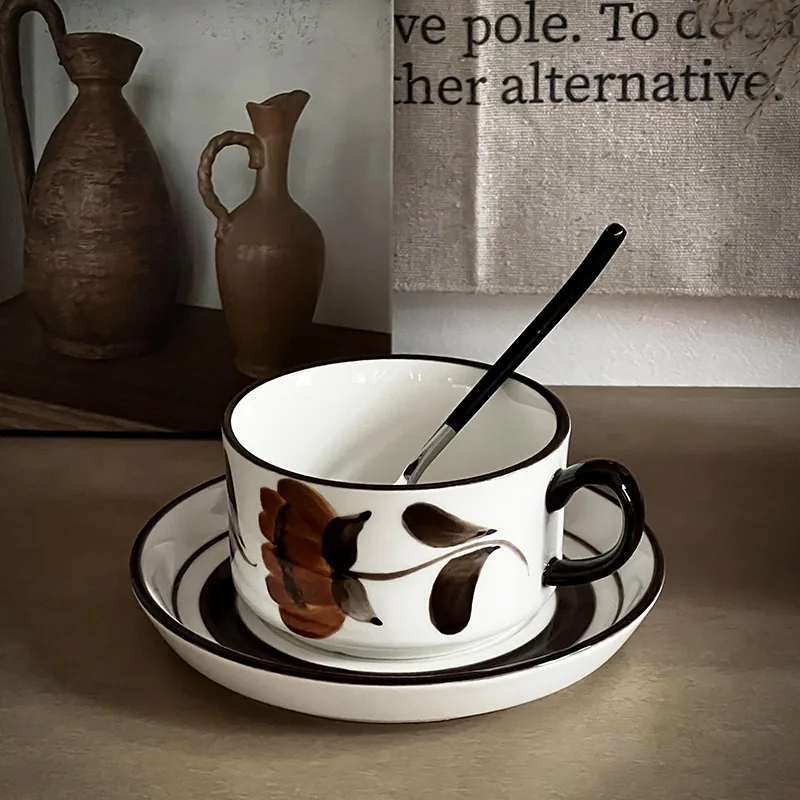 Brown flower ceramic coffee cup and saucer