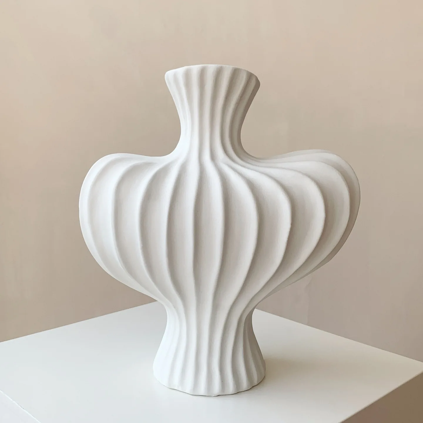 White sculptural ribbed ceramic vase product view