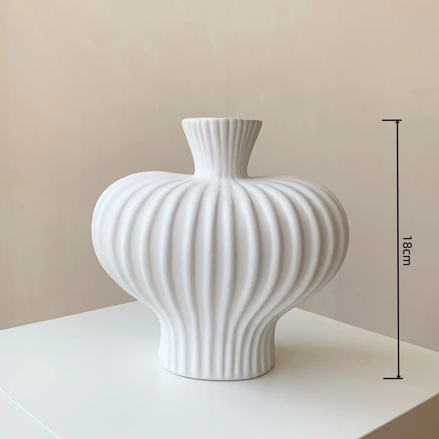Small white ribbed ceramic vase with 18 cm height