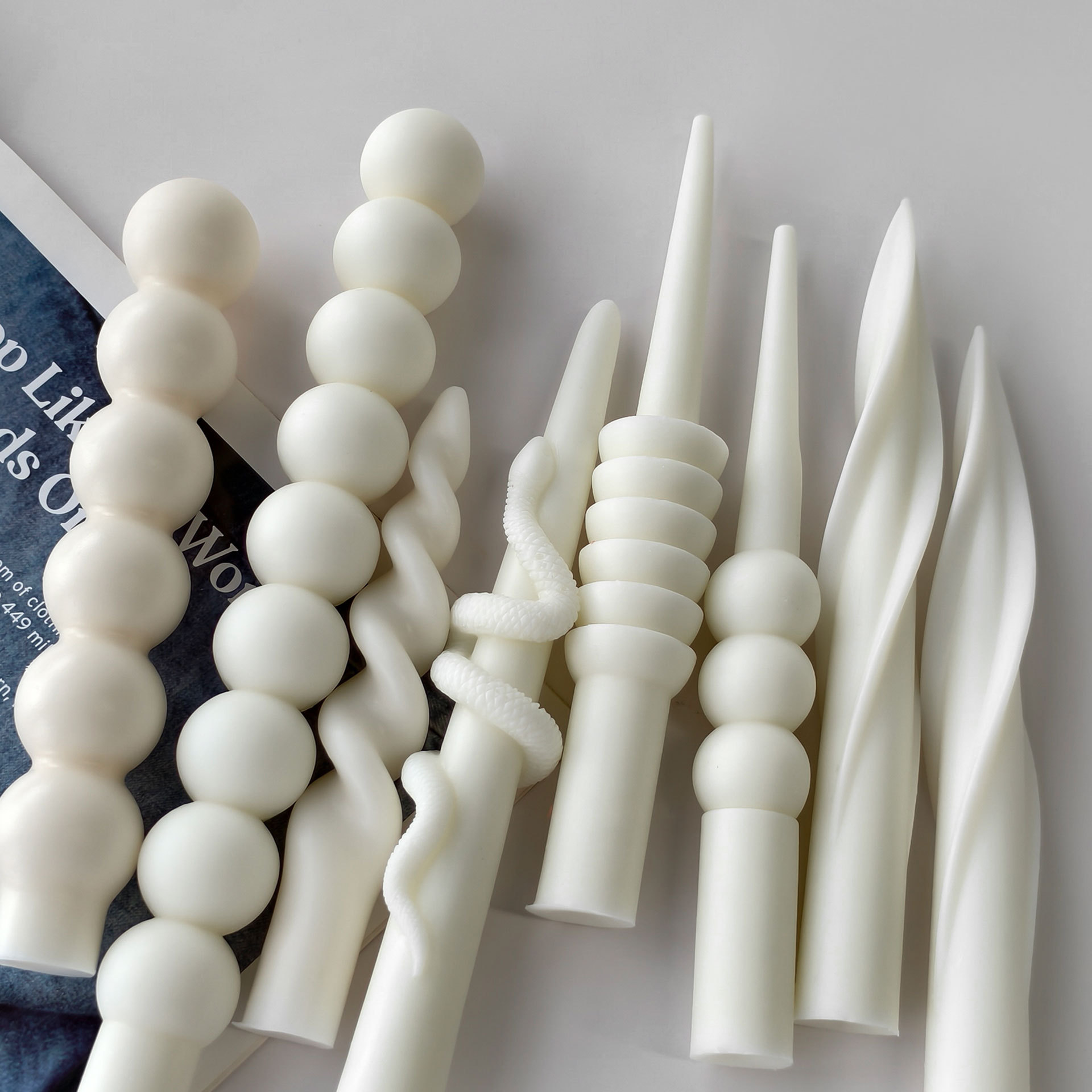 Sphere, twist and geometric taper candle designs