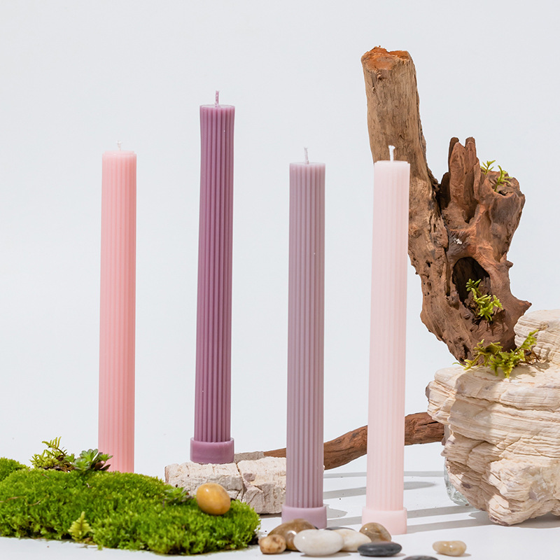 Pink and purple ribbed long pillar candles