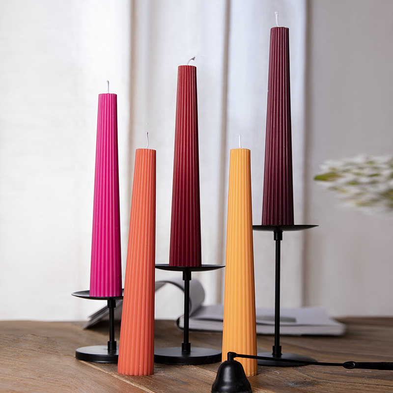 Vibrant red, orange and burgundy ribbed candles