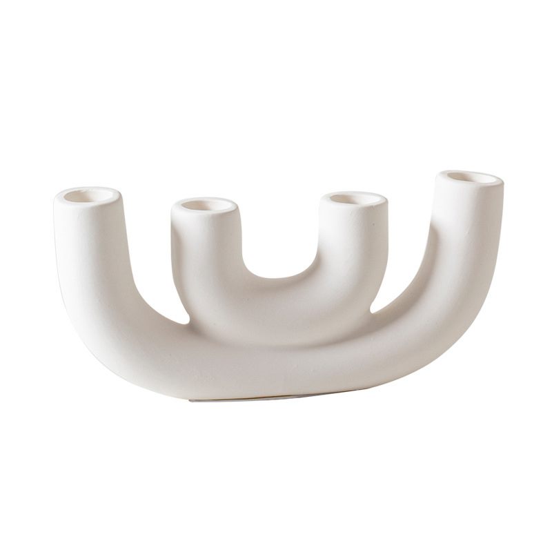 Wide white porcelain candle holder on a white background