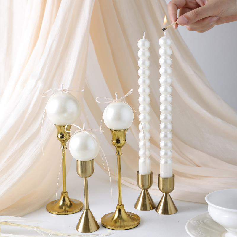 Pearl round and taper wedding candles on gold holders