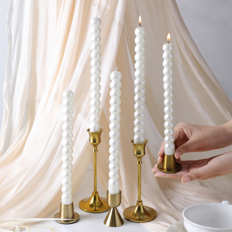Pearl white taper candles in assorted heights