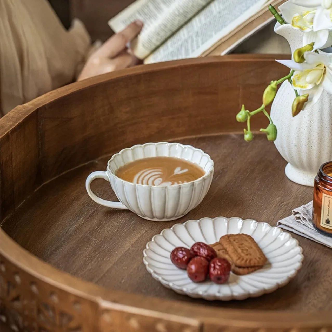 Petal ceramic cup and saucer styled on a wooden tray