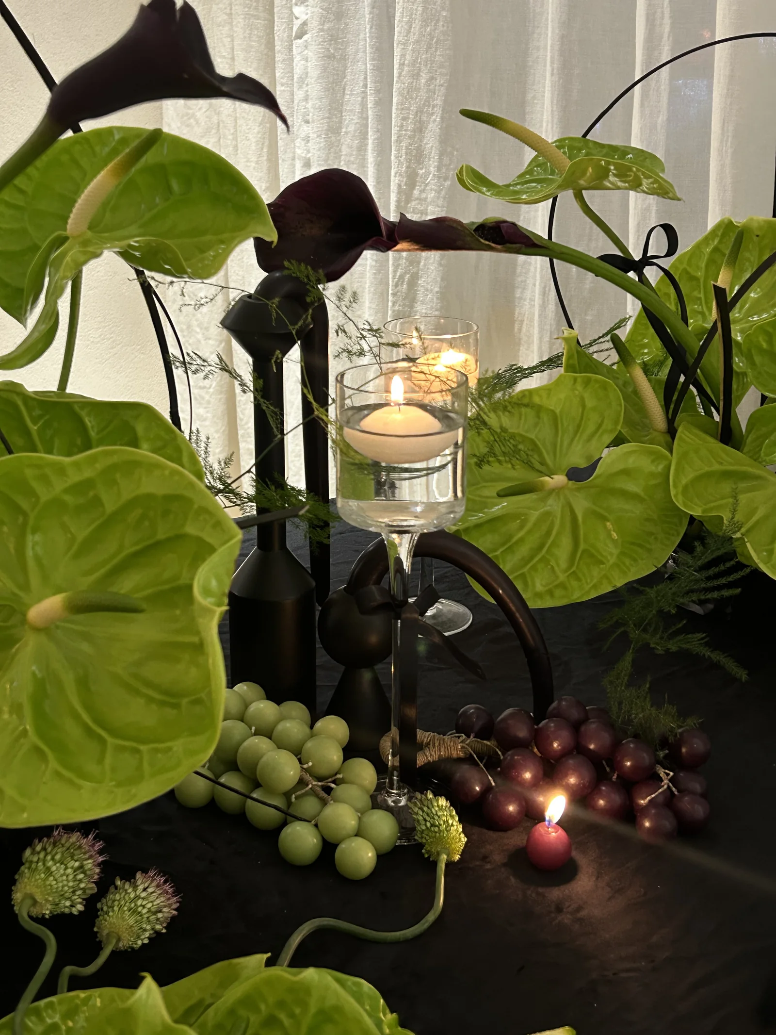 Grape cluster candles in a decorative tablescape