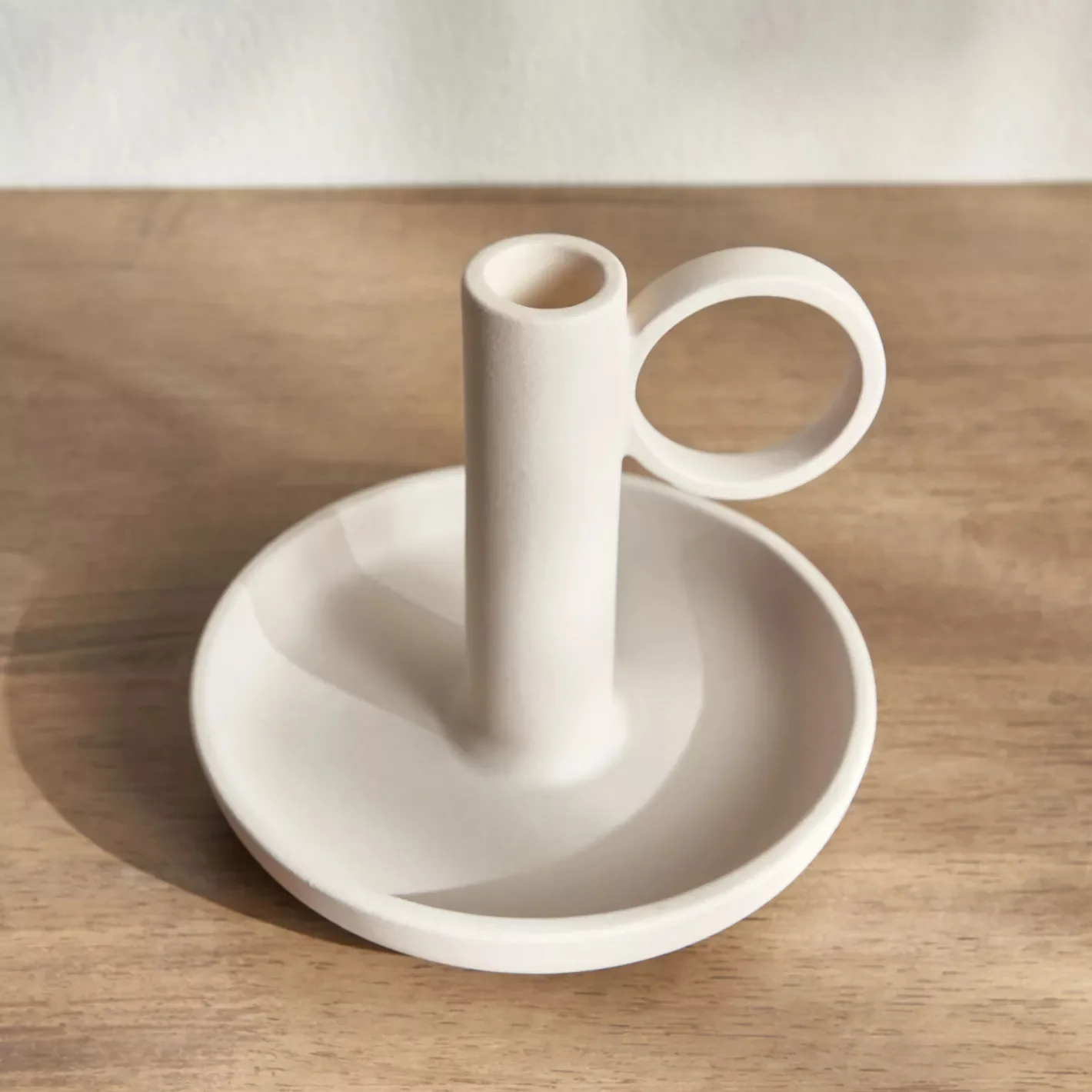 Close-up of the ceramic candle holder and tray