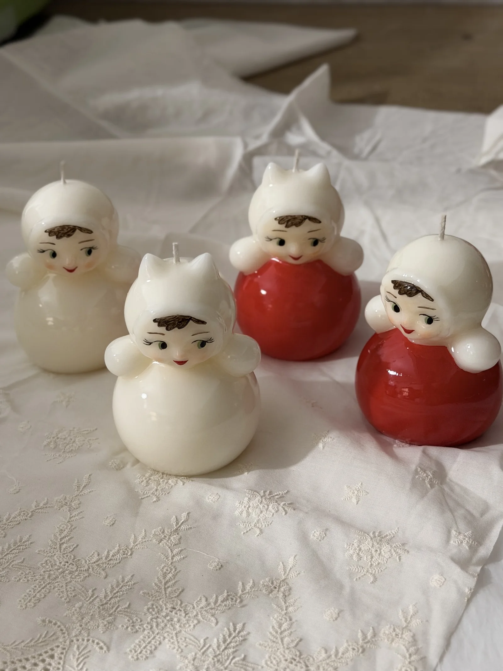 Four Russian doll candles standing upright