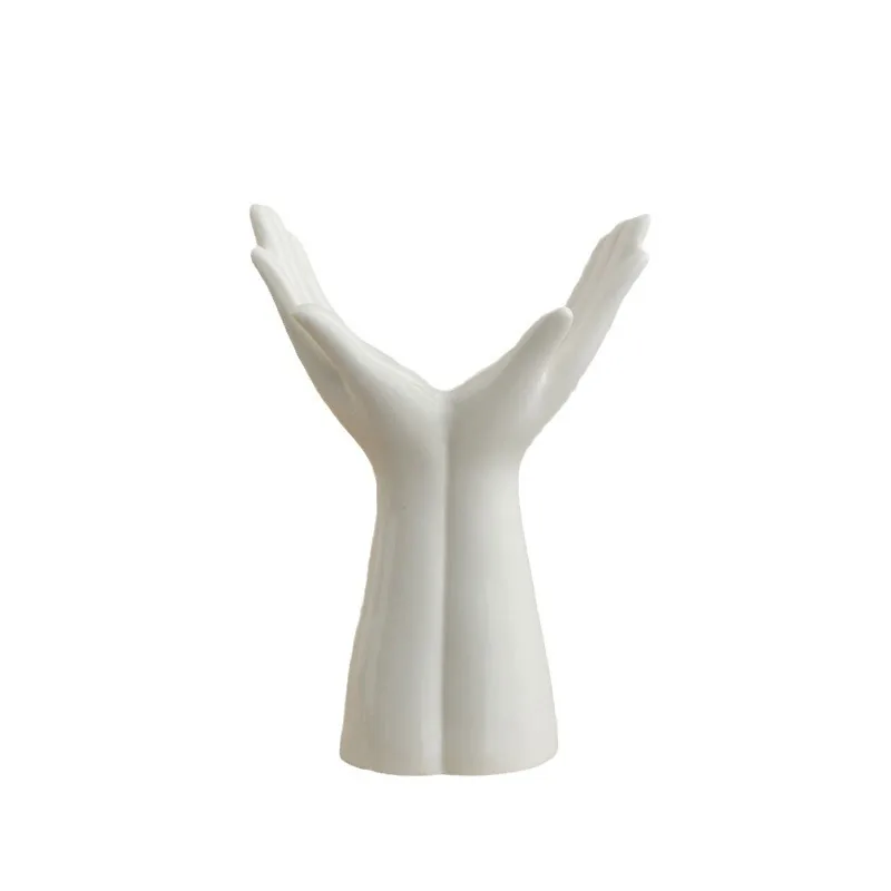 Small white sculptural hands vase