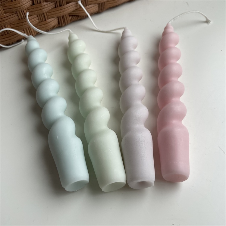 Pastel blue, green, lavender and pink spiral candles