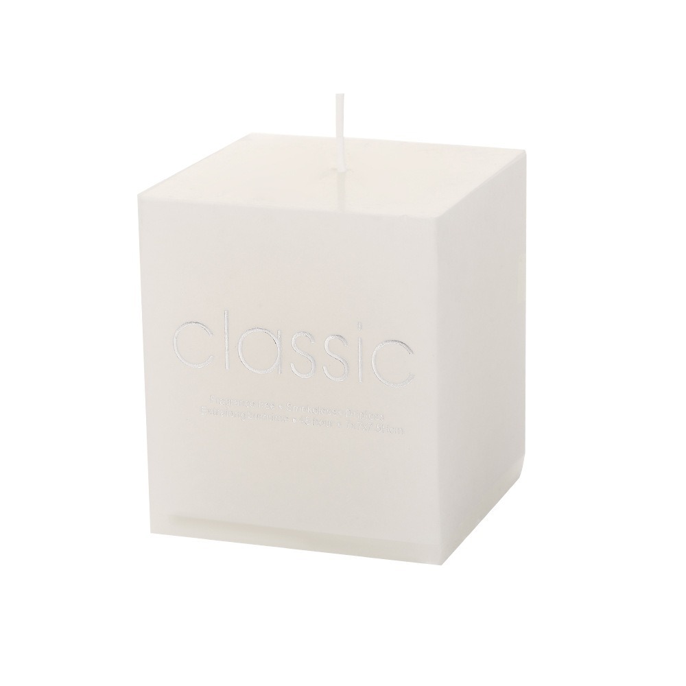White square pillar candle on a clean background