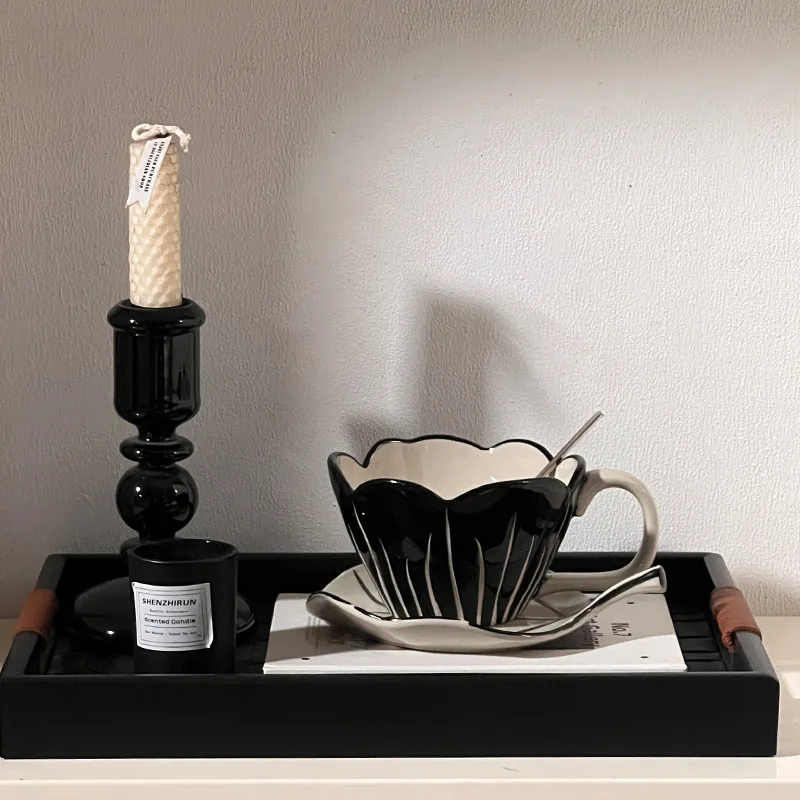 Black tulip coffee cup and saucer styled on a tray