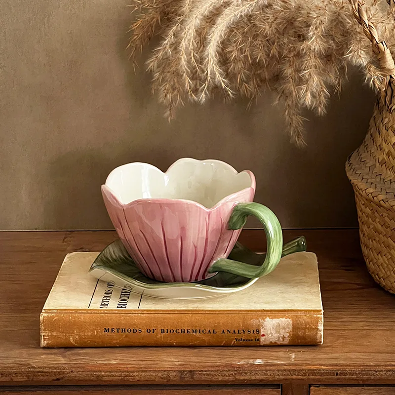 Pink tulip flower coffee cup with green leaf saucer