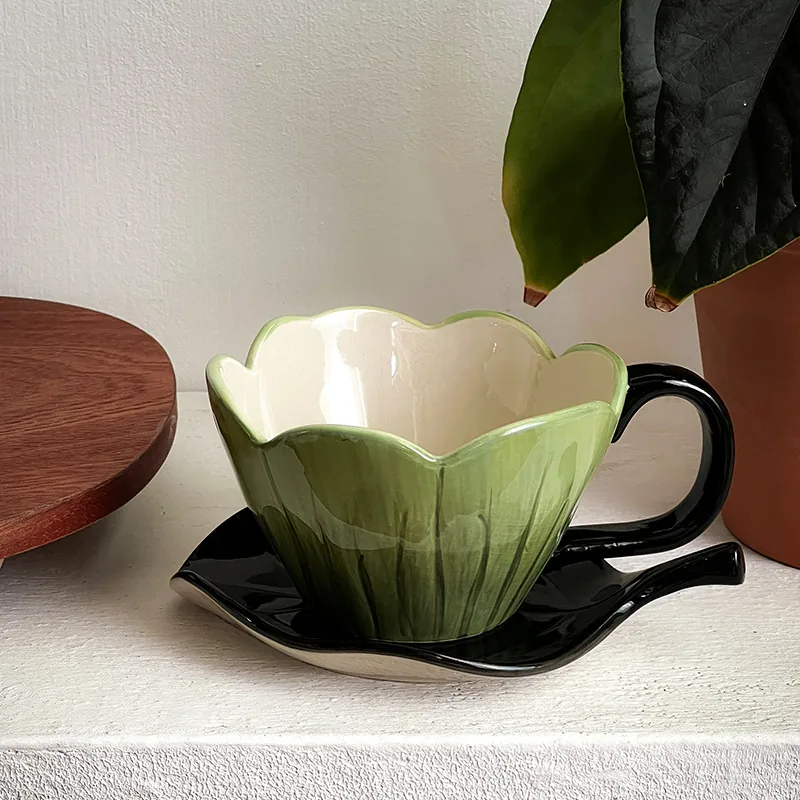 Green tulip ceramic coffee cup with black leaf saucer