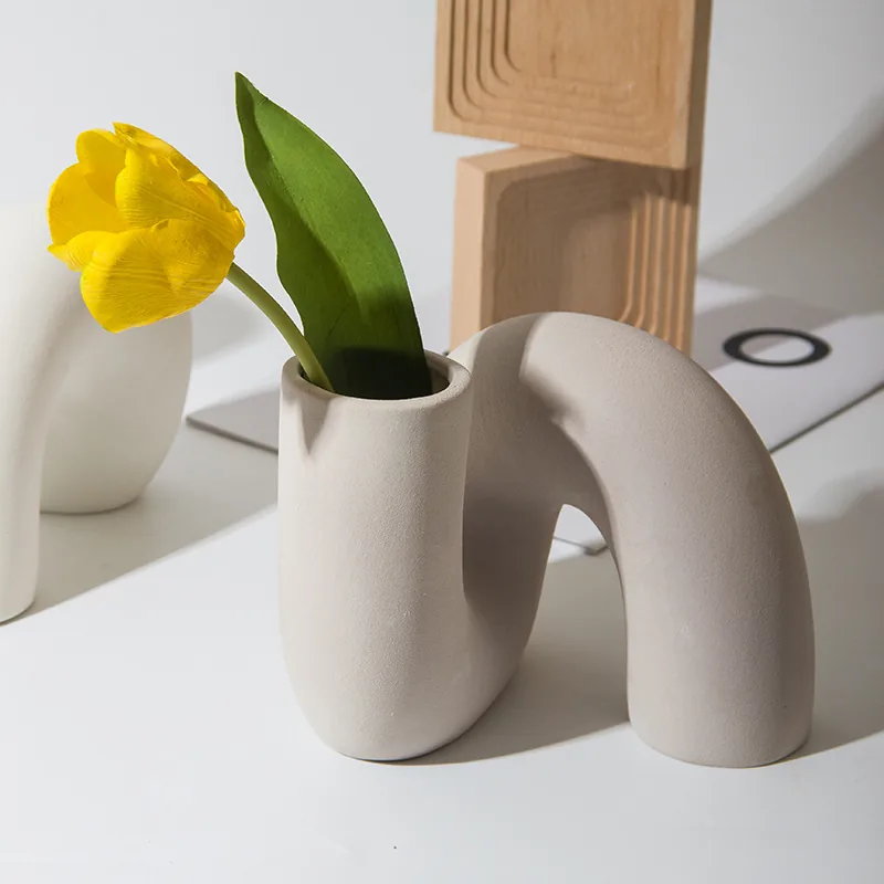Khaki twist ceramic vase styled with a yellow tulip