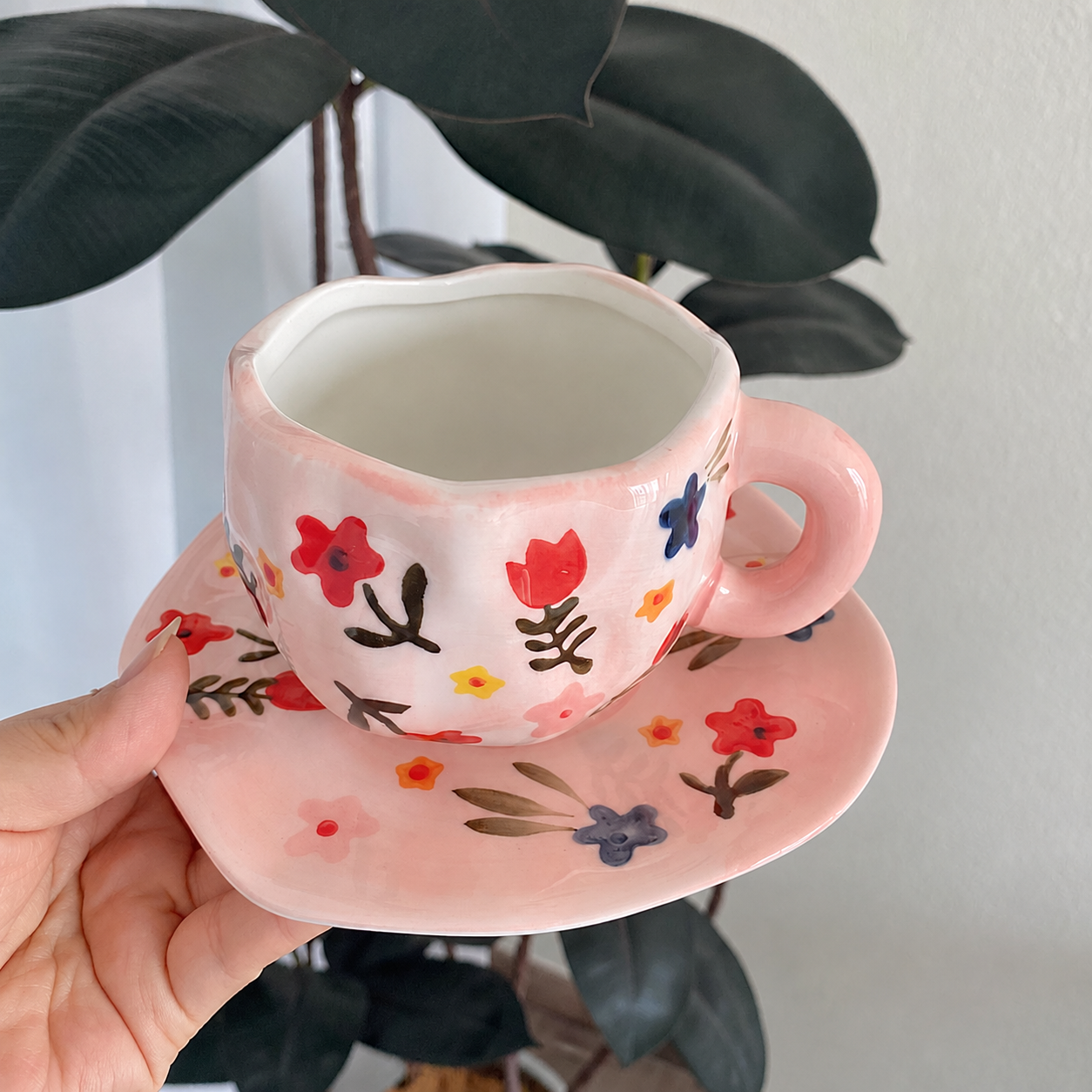 Pink botanical ceramic cup and saucer set