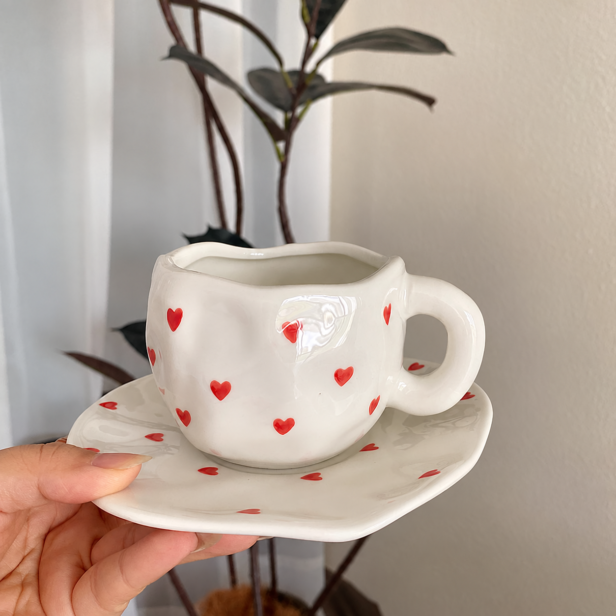 Red heart ceramic cup and saucer set