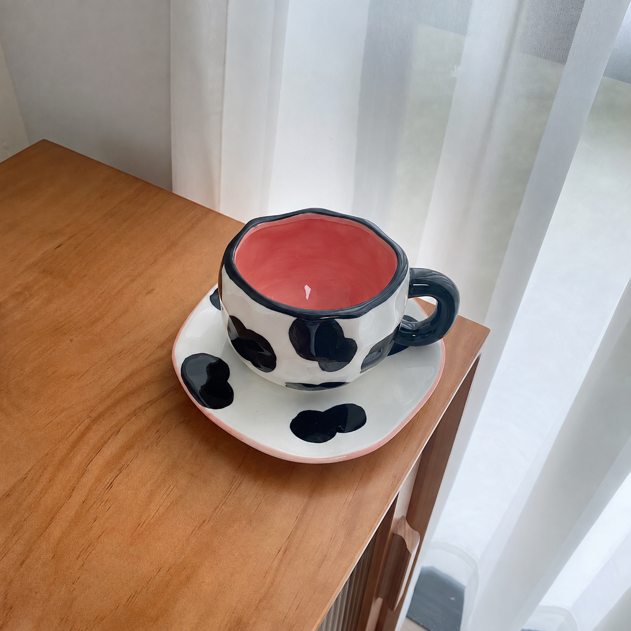 Black abstract ceramic cup and saucer set