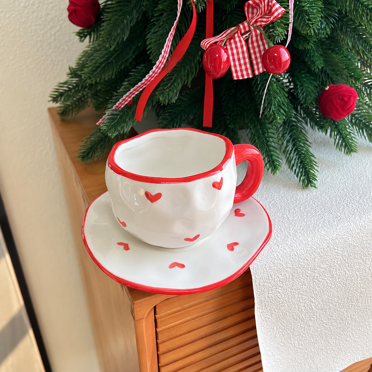 Red heart cup and saucer Christmas lifestyle view