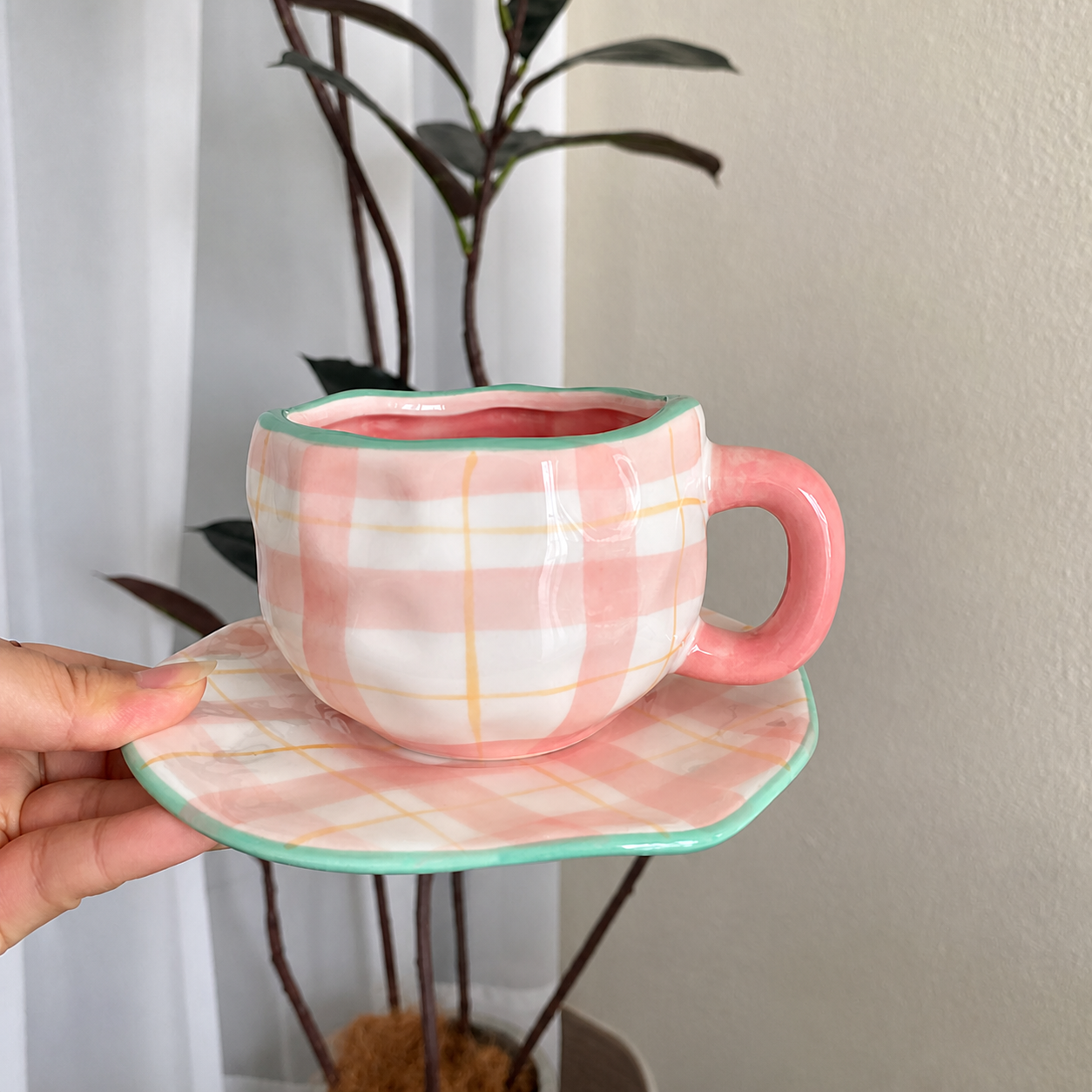 Pink plaid cup and saucer lifestyle view